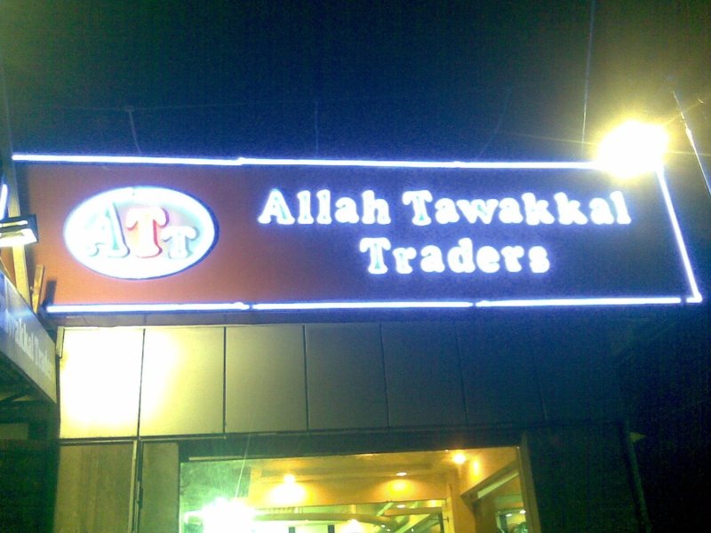 Graphic designer creating a custom hoarding board design for shop using design tools
