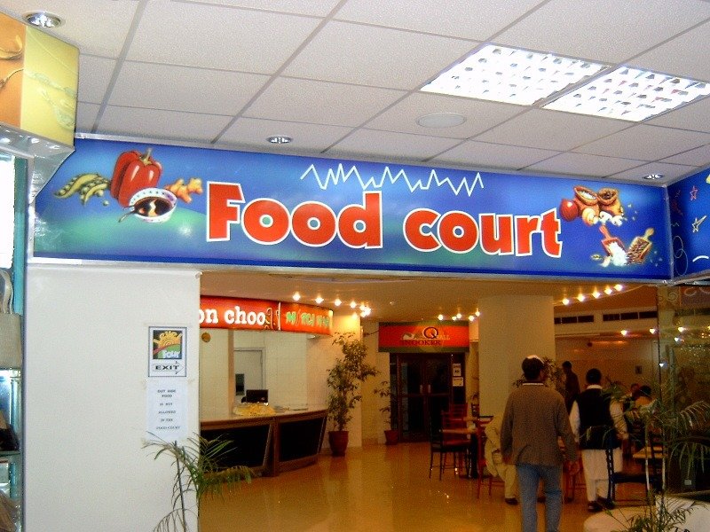 Creative hoarding board design displayed on a busy urban road for brand promotion