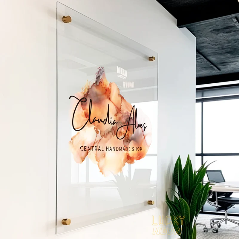 A clean non-lit acrylic nameplate sign board mounted with metallic spacers, ideal for professional branding.