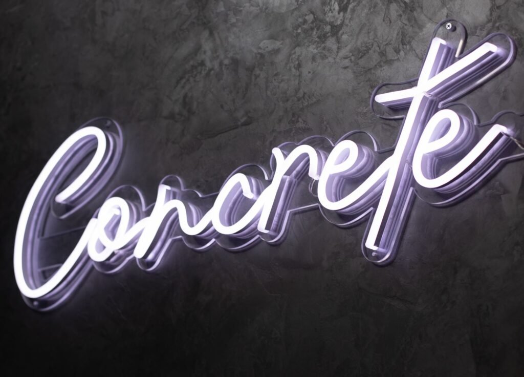 “Bright neon sign board reading ‘Cocktail BAR’ in glowing multicolor, ideal for bar décor.