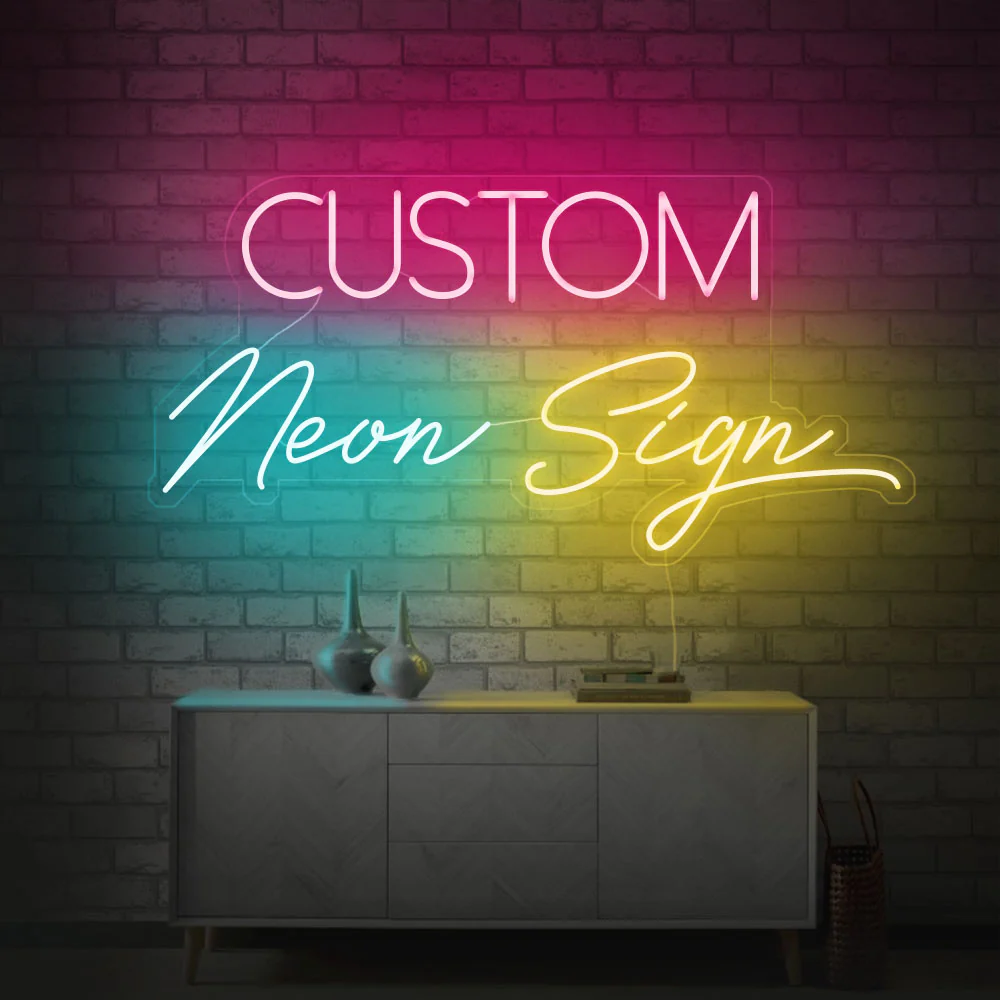 Display of multiple custom neon signs featuring different fonts and colors showcased on a table and cushion background.”