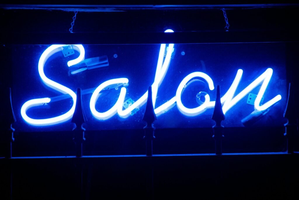 Backlit Flex Sign Board illuminated with LED lights at night.
