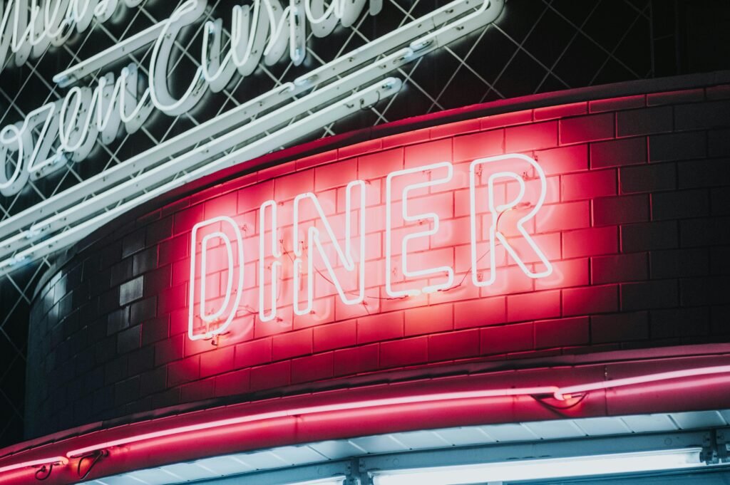 LED Neon Flex Sign glowing outside a café at night for branding.